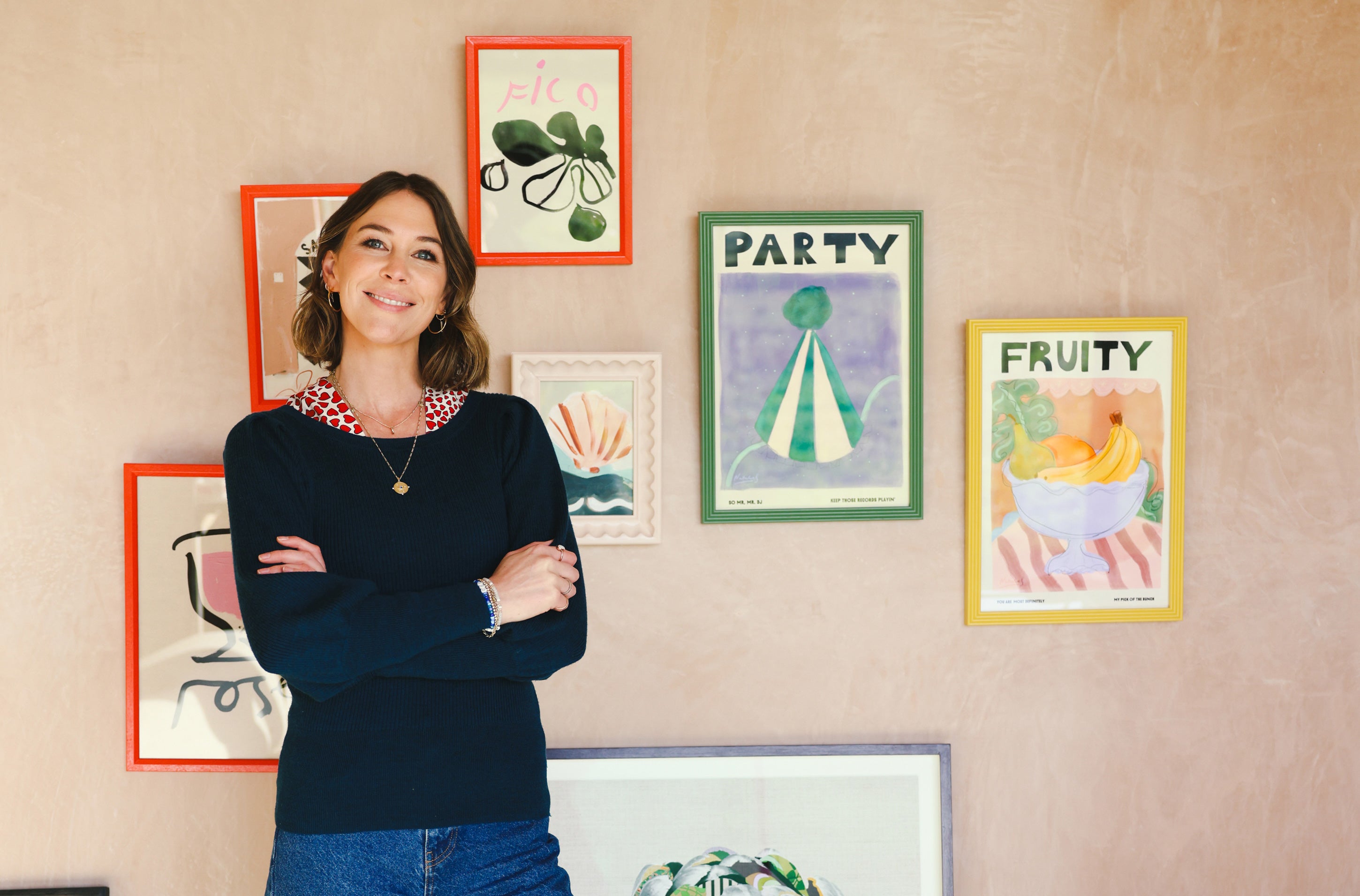 Artist Lucy Kent with prints from the Artch collection
